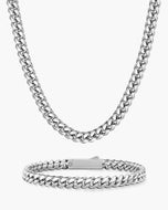 A silver Cuban link chain necklace and matching cuban link bracelet displayed on a clean white background.