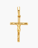 A polished gold crucifix pendant featuring a detailed figure of Jesus on a horizontal cross, suspended from a rectangular bail, shown against a plain white background.